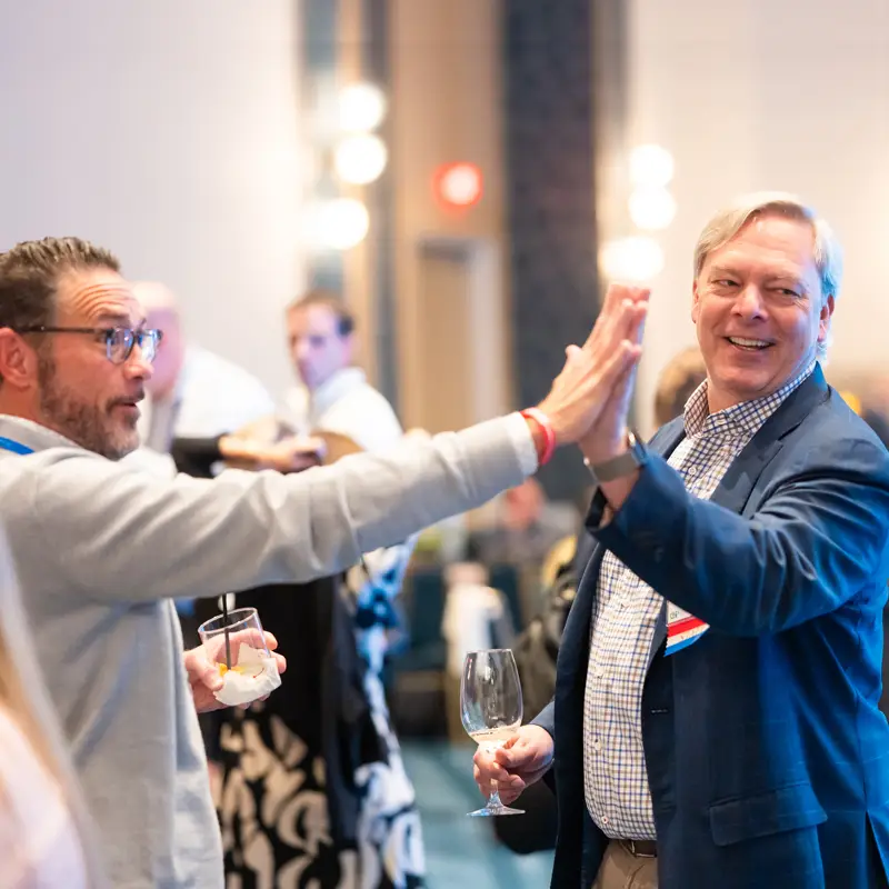 Two attendees celebrating